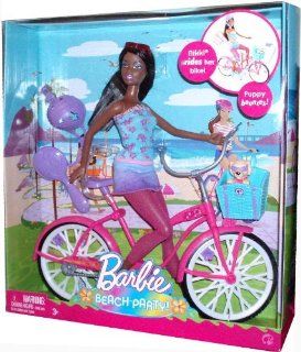 Barbie Beach Party 12 Inch Doll and Bicycle Playset (R5559)   NIKKI with Bicycle, Bike Helmet, Basket with Puppy, Sunglasses and Hairbrush: Toys & Games