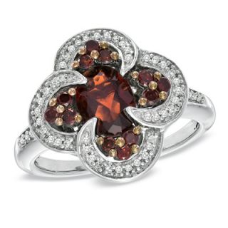 Oval Garnet and 1/3 CT. T.W. Enhanced Red and White Diamond Ring in