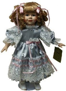 Standing Porcelain 18 Inches Doll with Curly Blond Hair and Blue Satin Dress with Lace Edging and Pink Ribbons: Toys & Games