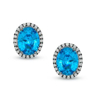 Oval London Blue Topaz and 1/5 CT. T.W. Diamond Earrings in Sterling